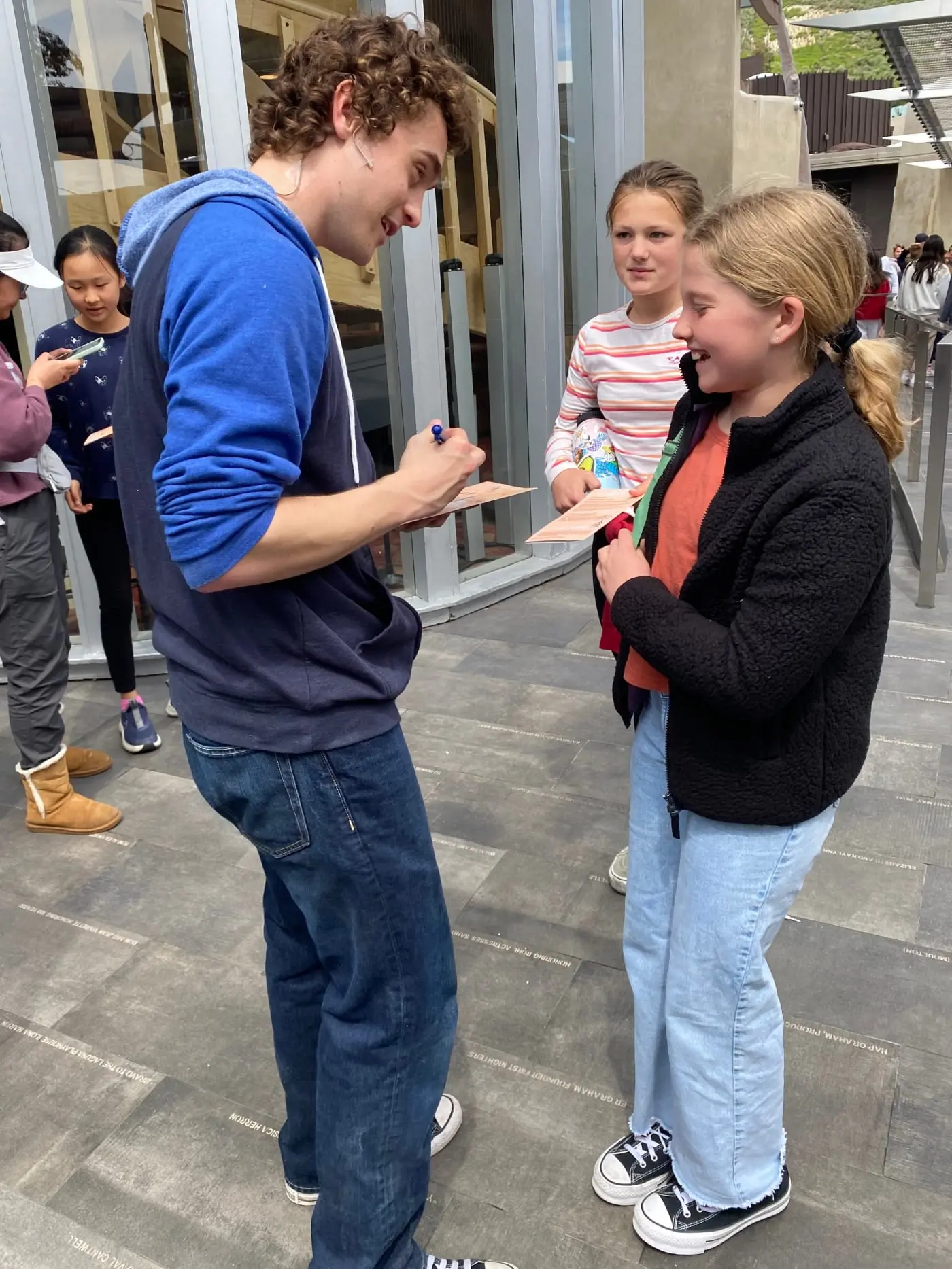 Percy Jackson (Dane Hobrecht) signs autographs at the Laguna Playhouse.